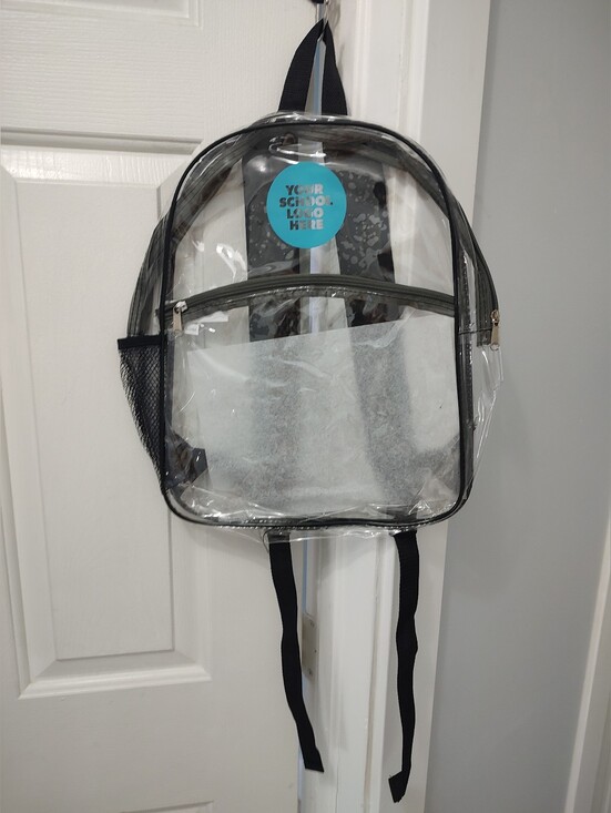Handbags - Clear backpack does have a spot with a blue circle that does not come off You co